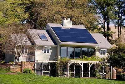 A Solar-powered house with panels on the roof.