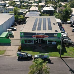 An aerial view of a building in Cairns with solar panels on the roof.