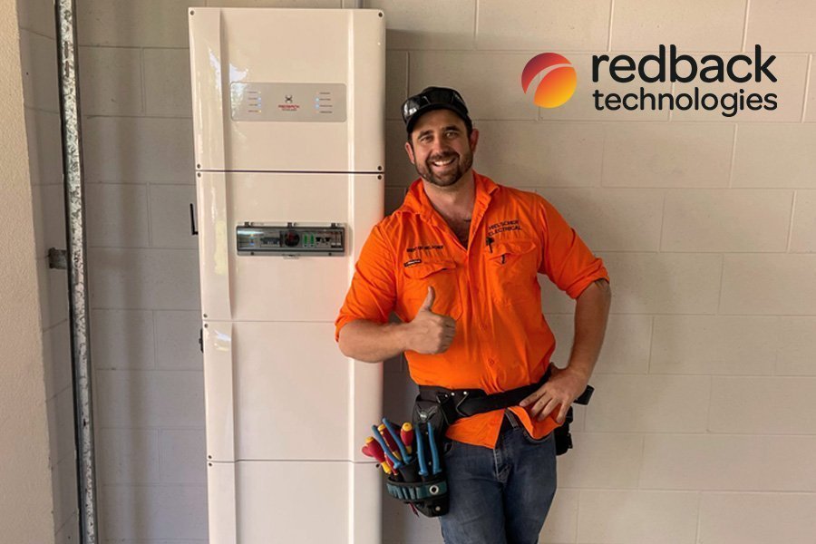 A man standing in front of a Cairns Solar Power unit.