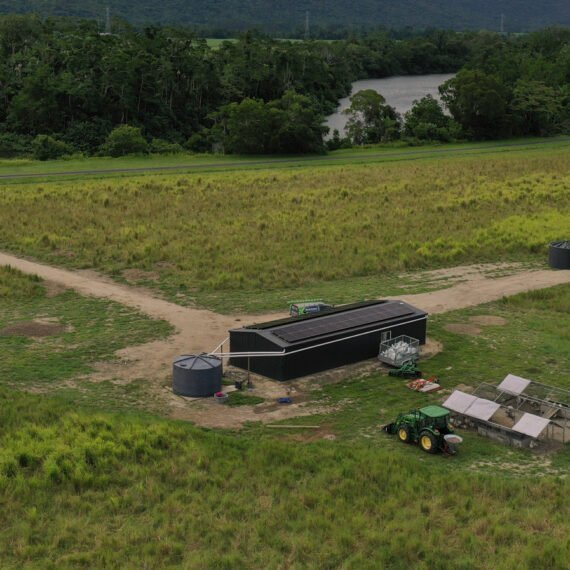 An aerial view of a farm in a field, featuring Hielscher Electrical's innovative solar power installation.