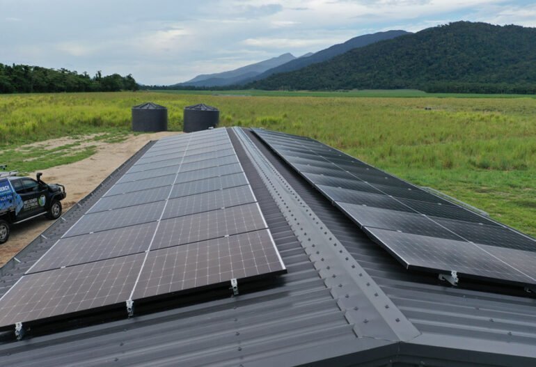 Solar panels installed on the roof of a farm, harnessing solar power to generate electricity.