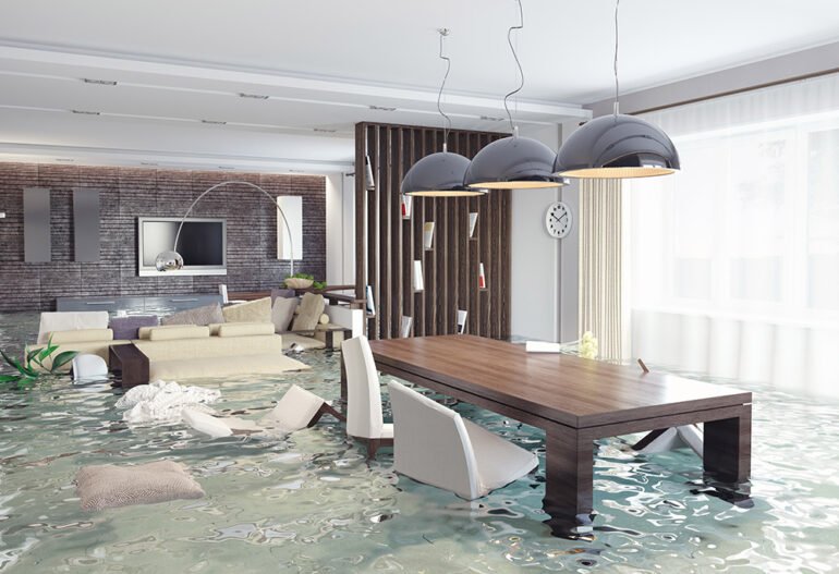 Flooded living room with furniture and a table in Cairns.