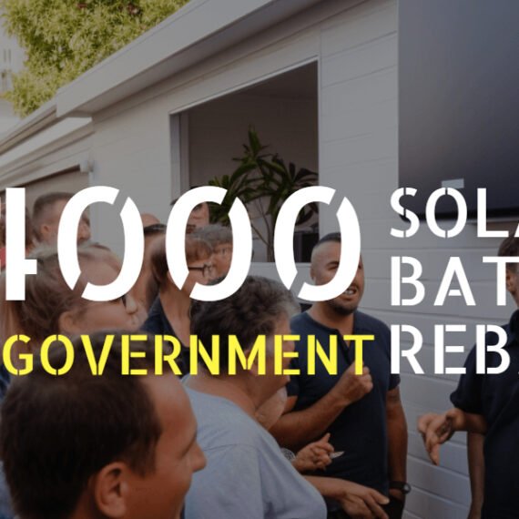 A group of people standing in front of a house with the words $4,000 solar battery qld government rebate and Solar Power.
