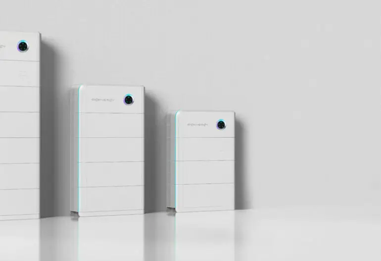 Three white rectangular battery storage units of varying sizes are neatly lined up against a light grey wall on a glossy white surface, highlighting the options available through the Cheaper Home Batteries Program in Cairns and surrounding Far North Queensland suburbs.