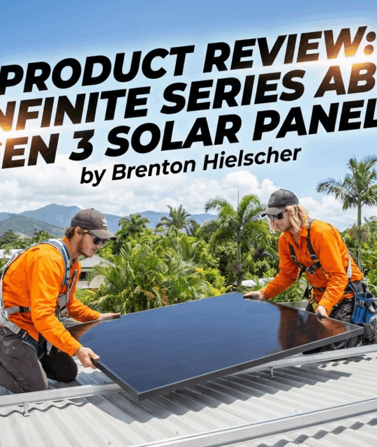 Two Hielscher Electrical Cairns Solar Installers in orange uniforms install Aiko solar panels on a Cairns metal roof; Far North Queensland mountains and palms in the background.