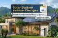 Modern house with solar panels and a battery amid lush greenery in Cairns. Text overlay notes solar battery rebate changes from May 2026 in Australia.